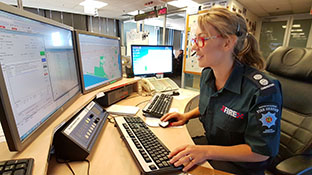 Female firefighter in the communications centre 